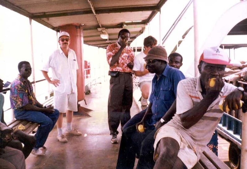 Photo of DRI personell on a boat in Ghana in 1993
