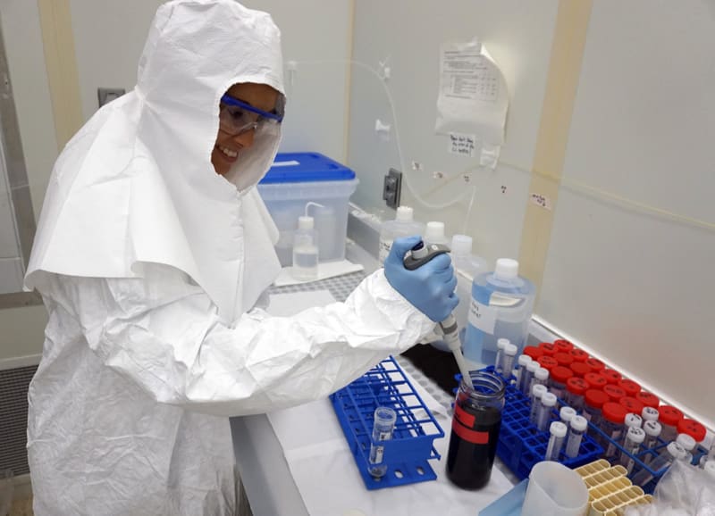 Monica Arienzo, PhD, assistant research professor of hydrology at DRI, demonstrates part of the black carbon analysis process in the clean room of DRI’s ultra-trace ice core analytical lab. Credit DRI.