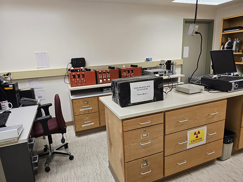 Image of a lab with an island and equipment on the counters. 