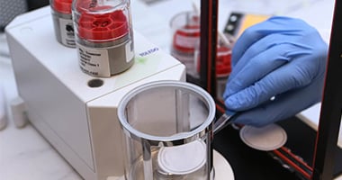 hand with glove in laboratory