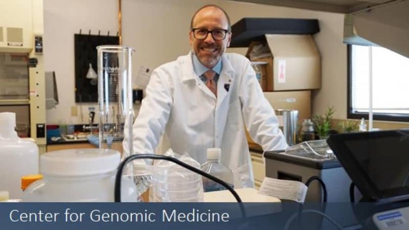 Joe Grzymski stands in the laboratory of the Center of Genomic Medicine