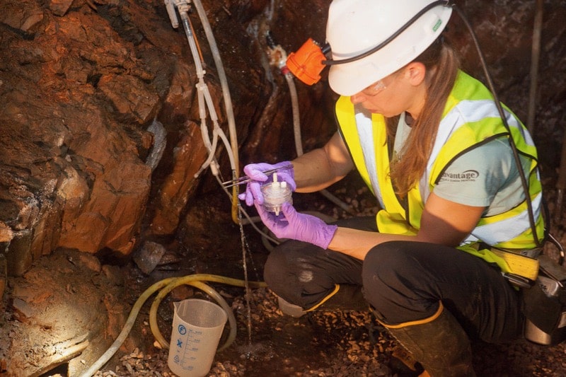 Brittany Kruger collects samples from an underground mine site. 
