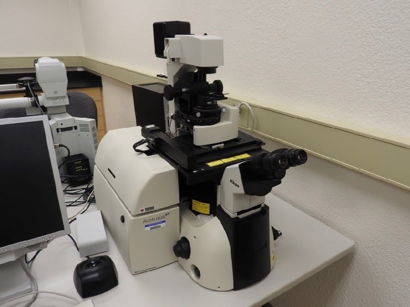 Nikon Eclipse inverted scope equipped with Arcturus laser microdissection system for cell capture and analysis.