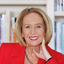 Marcia McNutt smiling for the camera wearing a red suit jacket