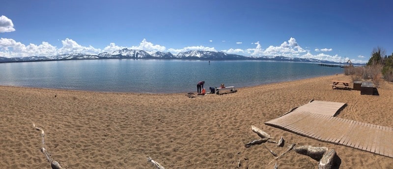 DRI microplastics researchers sample water from the shore of Lake Tahoe in spring 2019.
