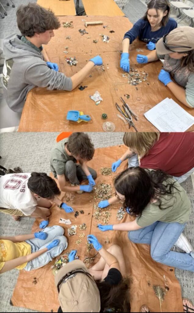 Student interns wearing gloves sorting microplastics on a tarp covered table that were collected from Lake Tahoe beaches.