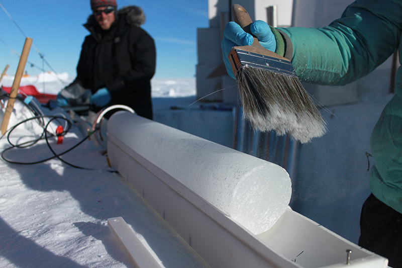 Researchers with Ice Core Sample in Greenland