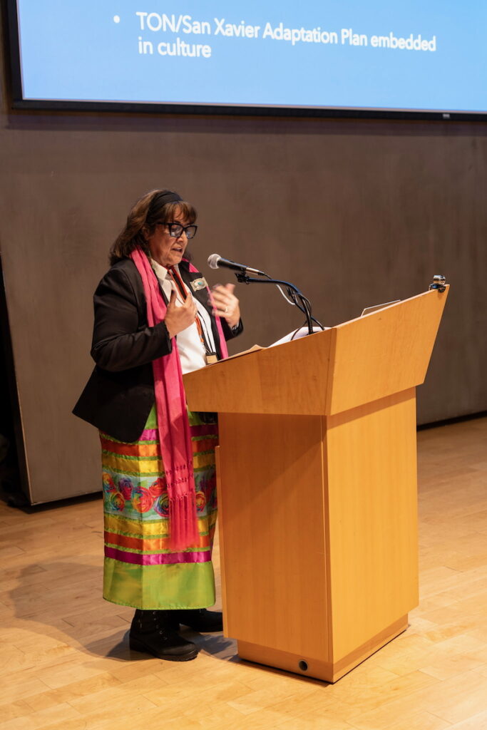 Mary C. Wilson speaking at a podium.