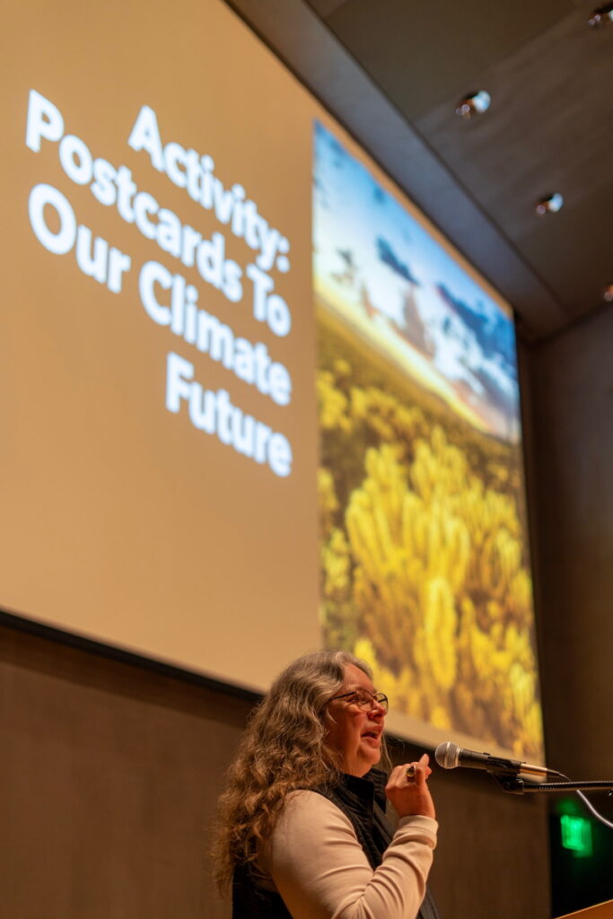 Maureen McCarthy speaking at a podium.