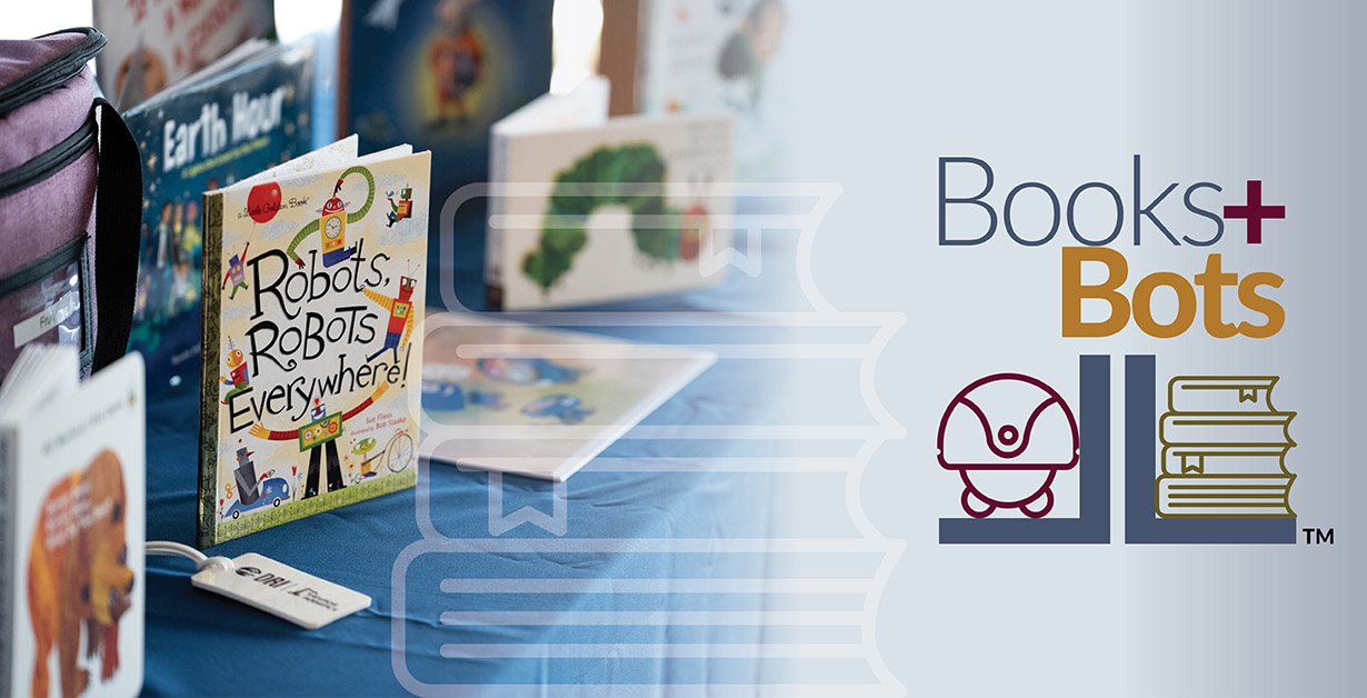 Books + Bots with a table with books on display about robots.