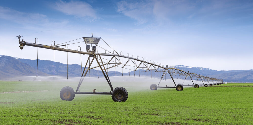 OpenET header image of center pivot watering crops