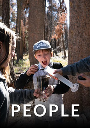The word People over an image of kids smiling and conducting an experiment in a wooded area. 