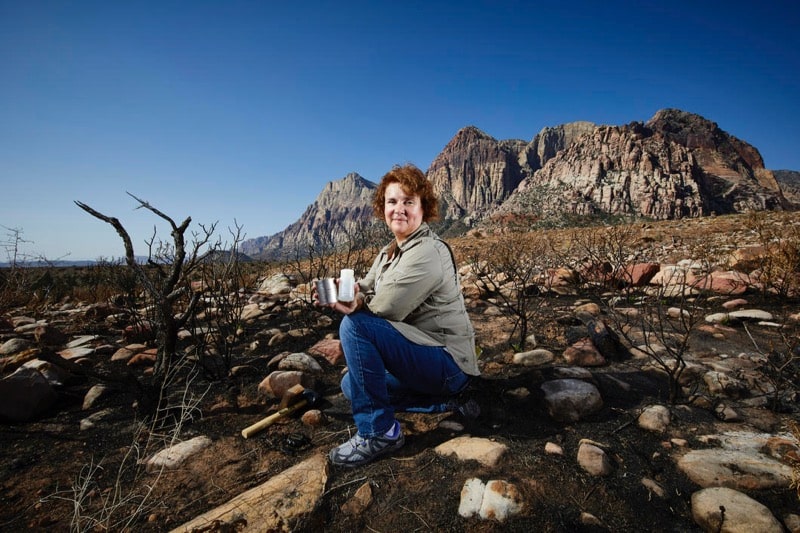 PhD candidate researcher Rose Shillito sits at burn site near Pine Creek Trail in Red Rock Canyon National Conservation Area. July 27, 2018. Credit: Josh Hawkins/UNLV Creative Services.