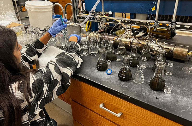 Female scientist testing water samples in lab