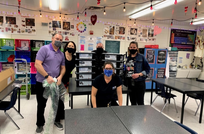 AJ Long from Nevada Robotics poses with robotics educators at Traner Middle School during the drop off of the donated classroom set of FIRST robots.