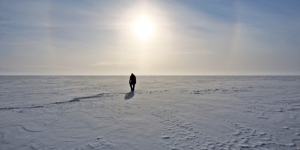 Photo of researcher on antarctic ice.