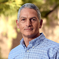 Headshot of Dr. Vic Etyemezian outside with trees in the background. 