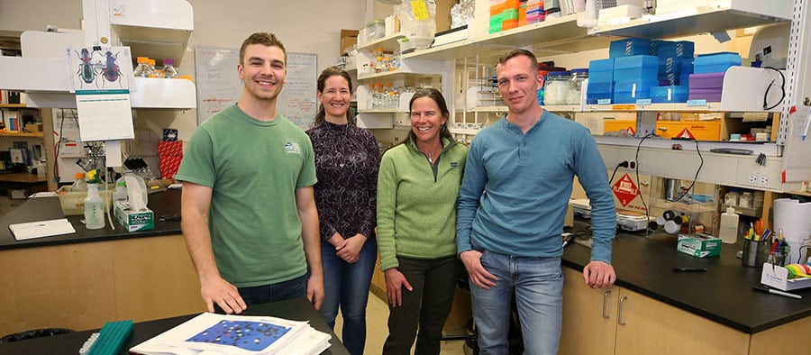 Molecular Microbial Ecology and Genomics Laboratory Research Team from left Lucas Bishop, Dr. Zoe Harrold, Dr. Alison Murray and Eric Lundin pose in the molecular microbial ecology lab at the Desert Research Institute, in Reno, Nev. Photo by Cathleen Allison/Nevada Momentum